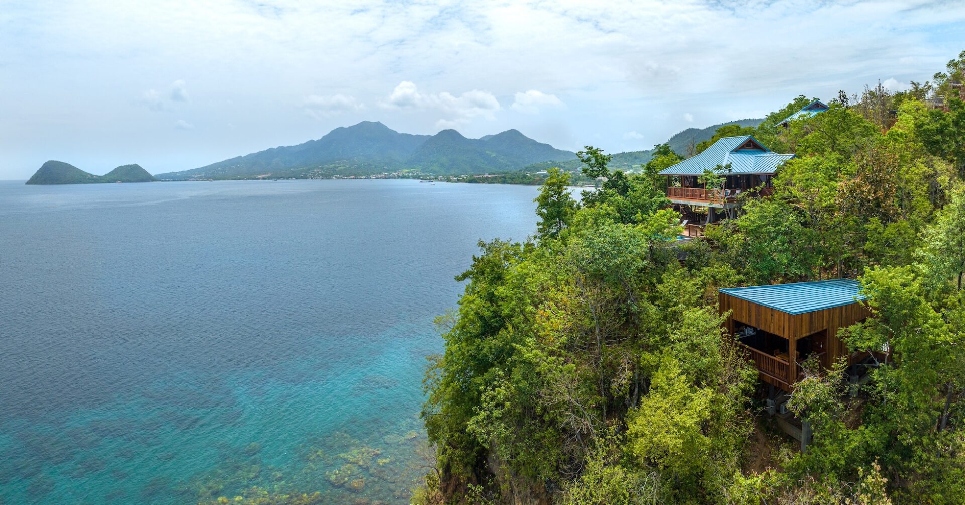 Aerial view of Secret Bay villas above Dominica's Caribbean coastline